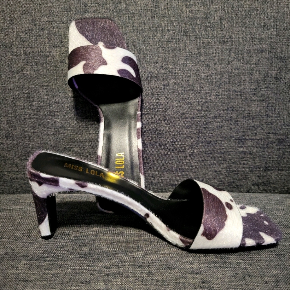 Cow print heel mules